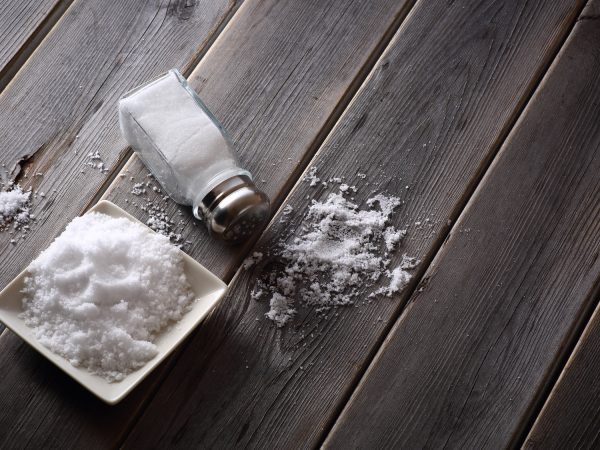 salt shaker on wooden table