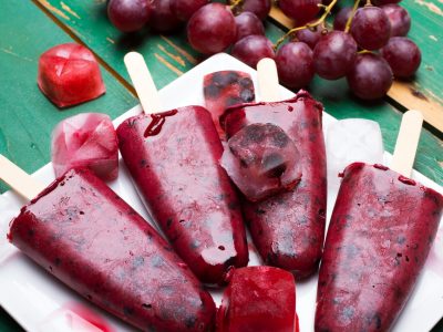 Homemade blueberry and grape ice cream on a stick