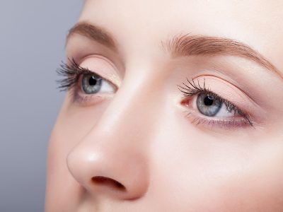 Closeup shot of female blue colour eyes with day makeup