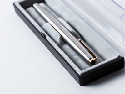 Pen in box on white background
